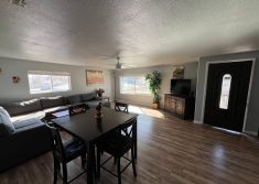 Living room with dining area at The Haven River Lodge rental