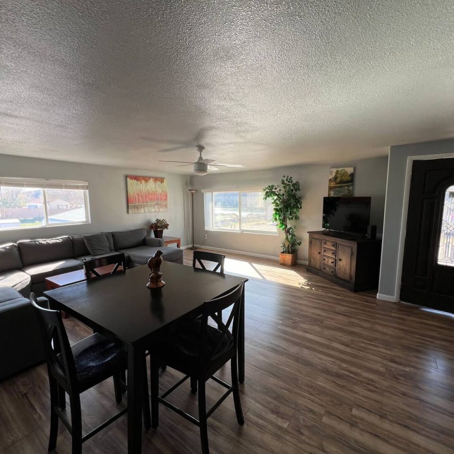 Living room with dining area at The Haven River Lodge rental