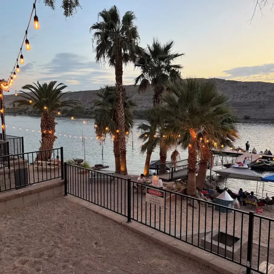 Picnic area with palm trees at The Haven River Lodge, Bullhead City AZ