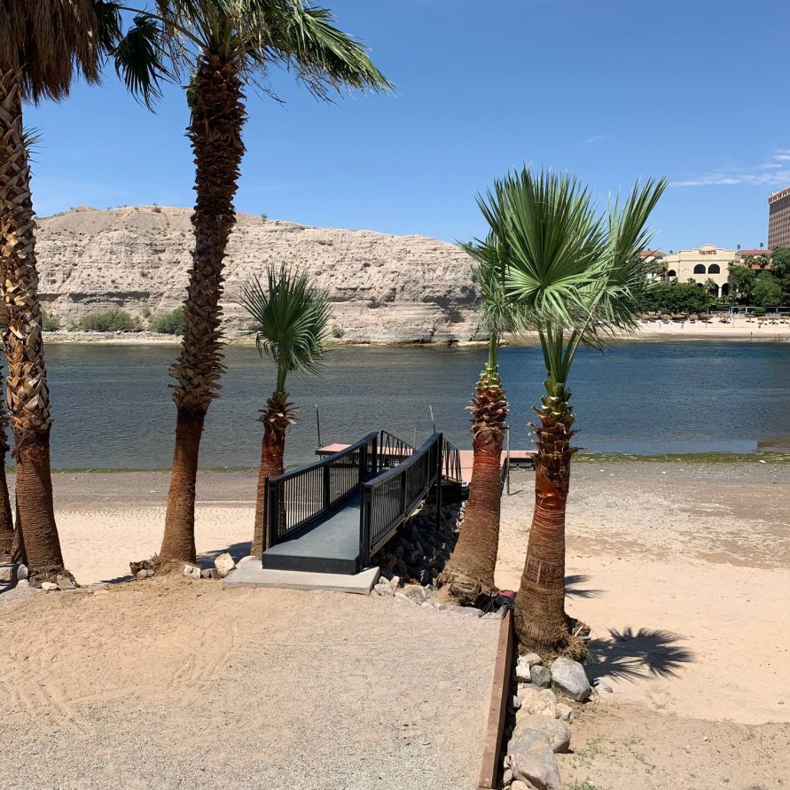 Picnic area with palm trees at The Haven River Lodge, Bullhead City AZ