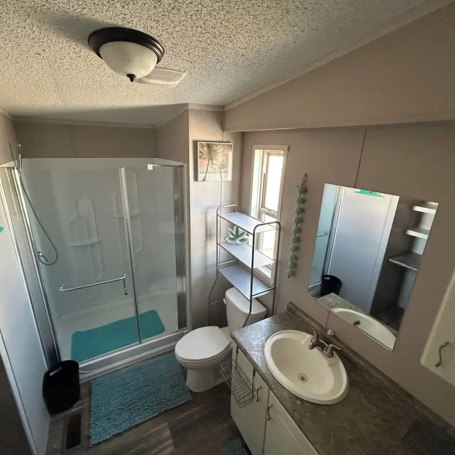 Bathroom with walk-in shower in riverfront rental suite