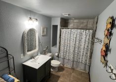 Bathroom with walk-in shower in riverfront rental suite