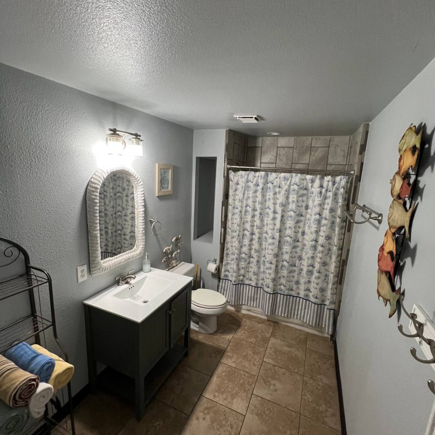 Bathroom with walk-in shower in riverfront rental suite