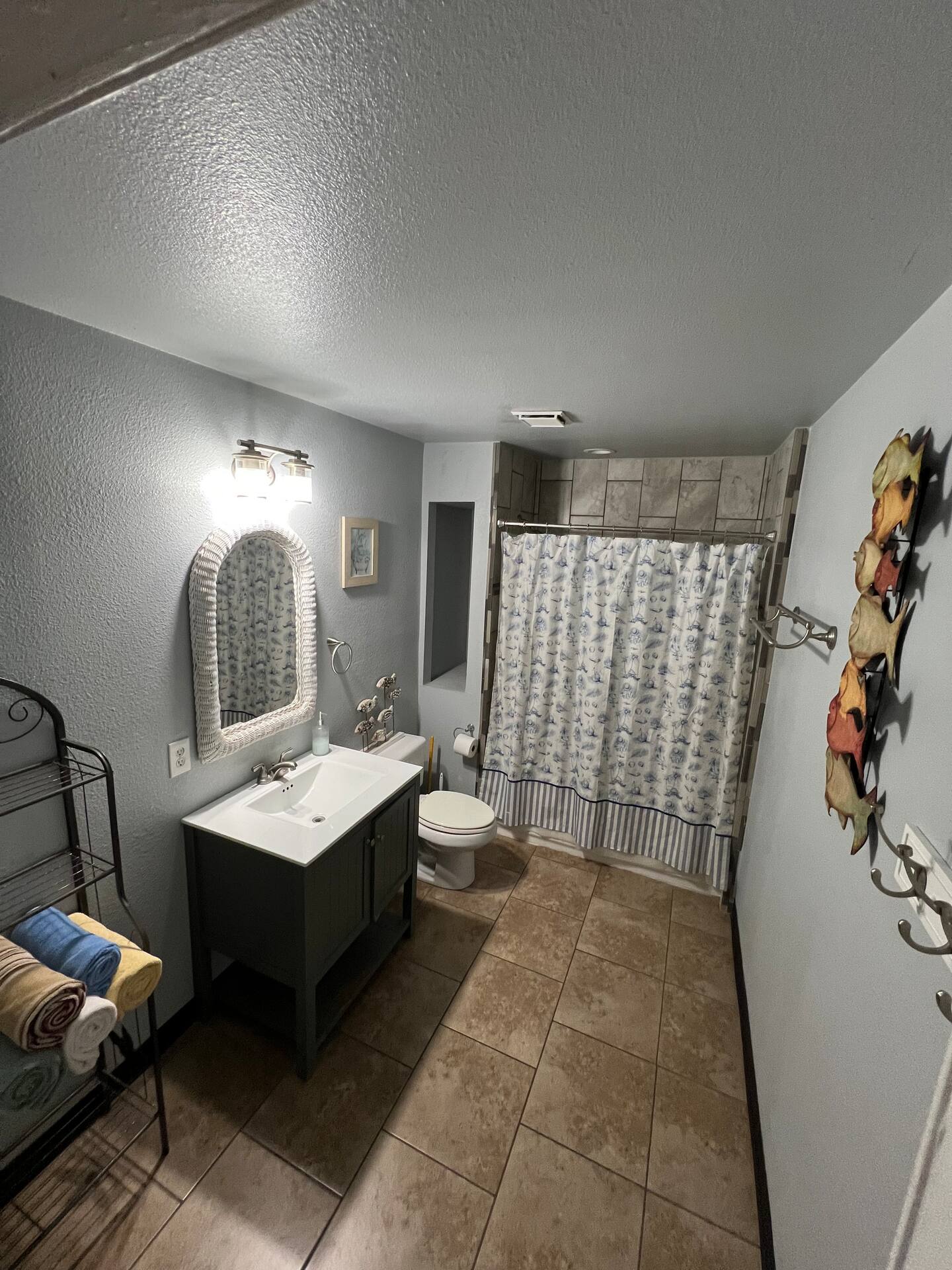 Bathroom with walk-in shower in riverfront rental suite