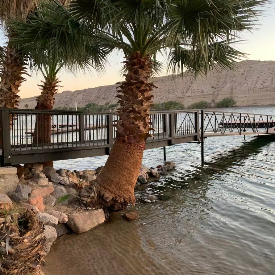 Riverfront view with dock at The Haven River Lodge